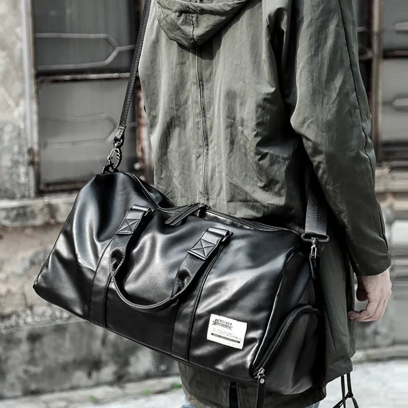 Black waterproof PU leather sports training bag showing multiple internal compartments and carrying handles