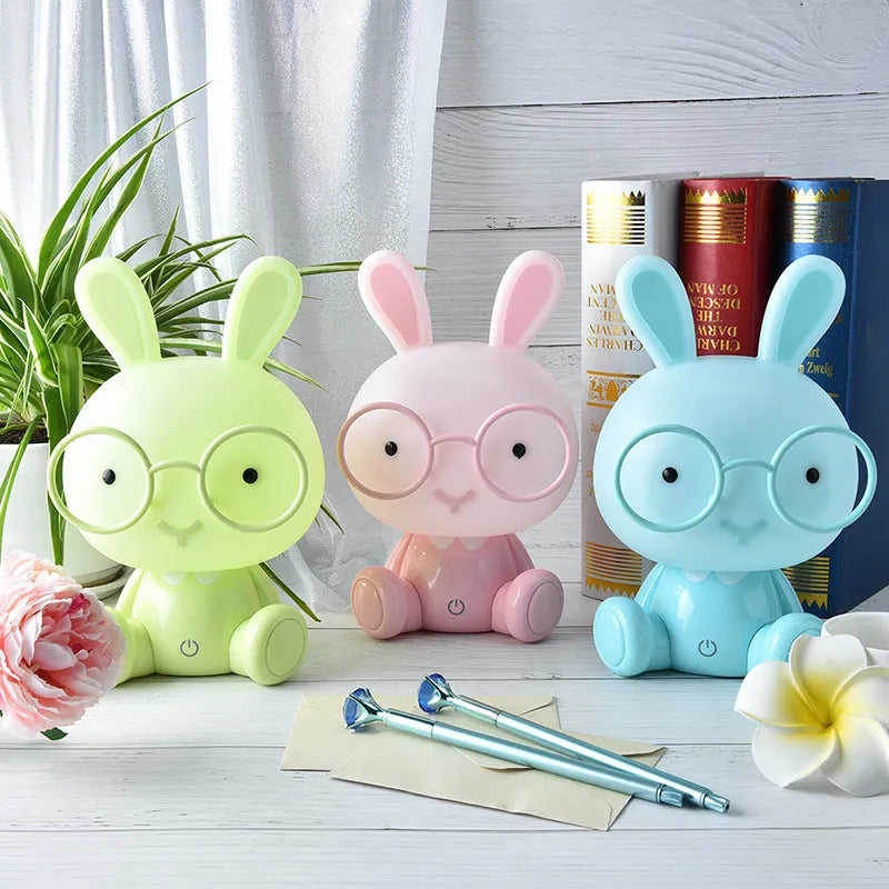 USB-powered cartoon rabbit night light with glasses in blue, green, or pink colour options