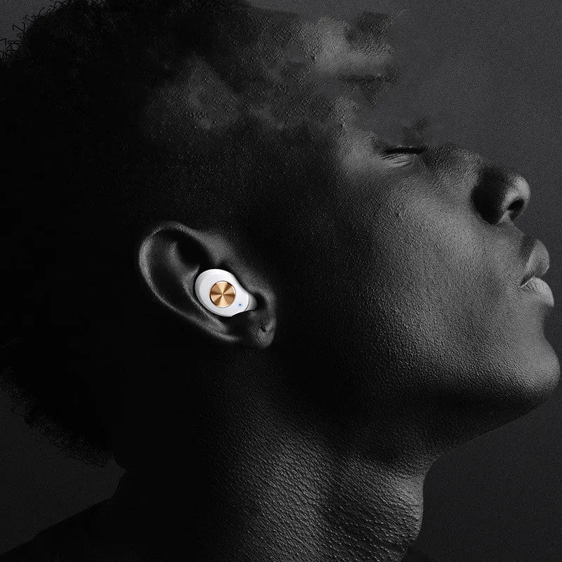 Pebble Series white wireless Bluetooth earbuds next to their compact charging case.