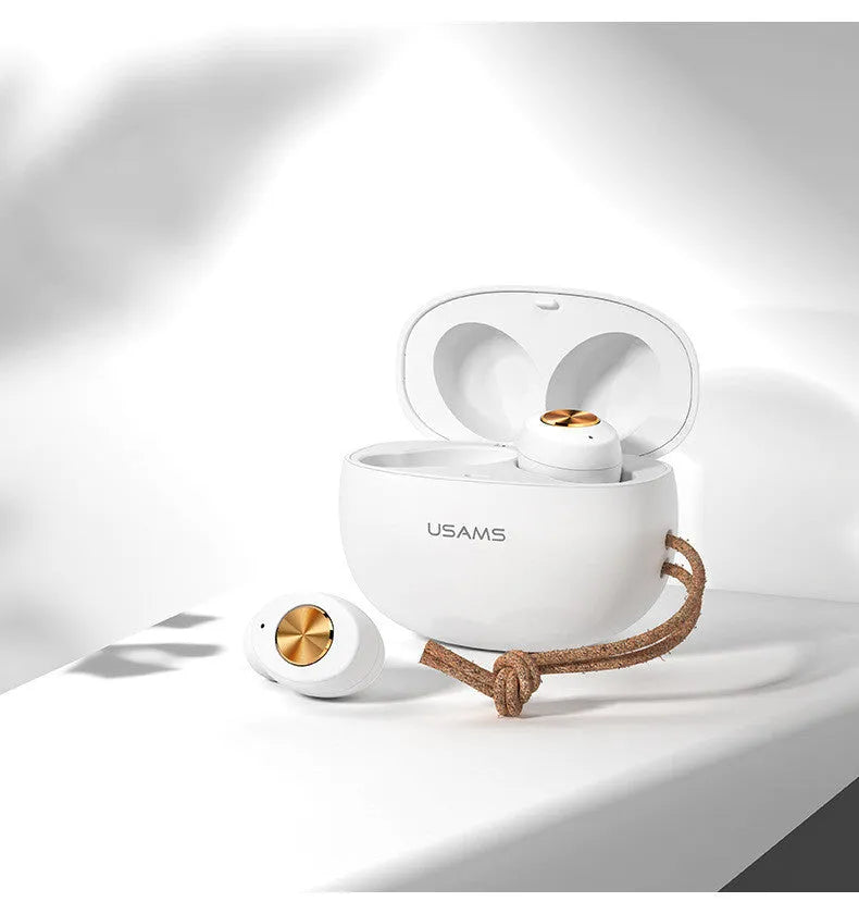Pebble Series white wireless Bluetooth earbuds next to their compact charging case.