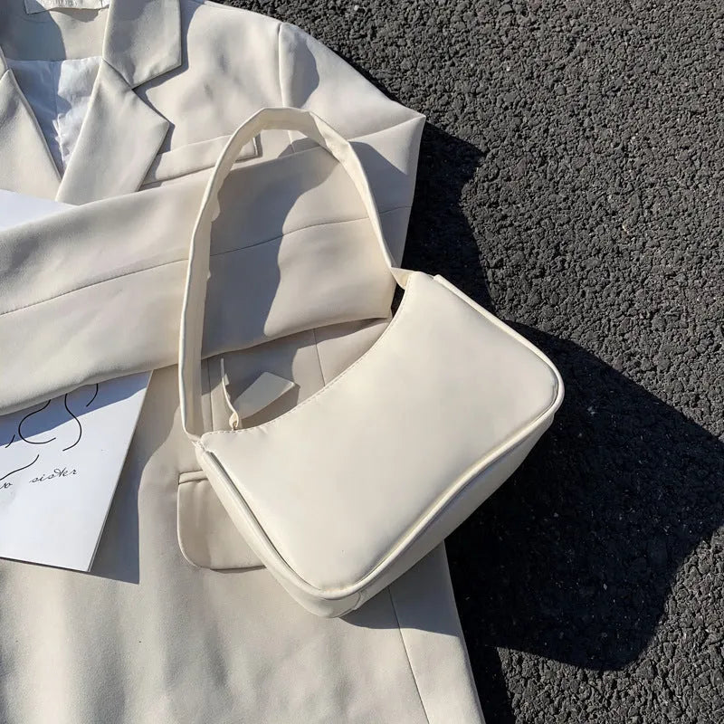 Women's one-shoulder armpit bag in soft PU, horizontal square shape, zip closure, available in 8 colours including white, black, pink, and khaki