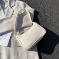 Women's one-shoulder armpit bag in soft PU, horizontal square shape, zip closure, available in 8 colours including white, black, pink, and khaki