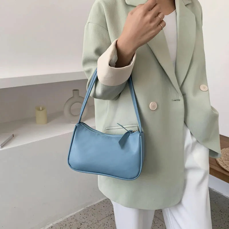 Women's one-shoulder armpit bag in soft PU, horizontal square shape, zip closure, available in 8 colours including white, black, pink, and khaki