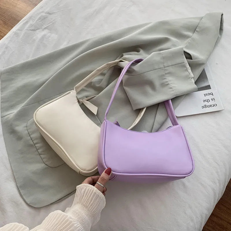 Women's one-shoulder armpit bag in soft PU, horizontal square shape, zip closure, available in 8 colours including white, black, pink, and khaki