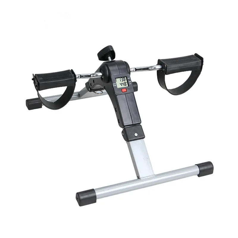 Black mini bike leg trainer with mechanical resistance, rubber and steel body, 36cm by 48cm by 23.3cm