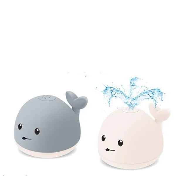 Grey and white whale bath toy with water spray, LED lights, and automatic water-sensing activation
