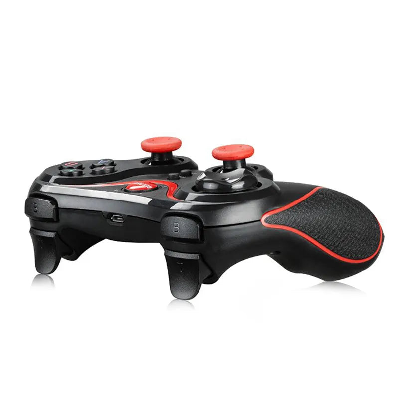 Black wireless Bluetooth gamepad for mobile phones on a dark surface