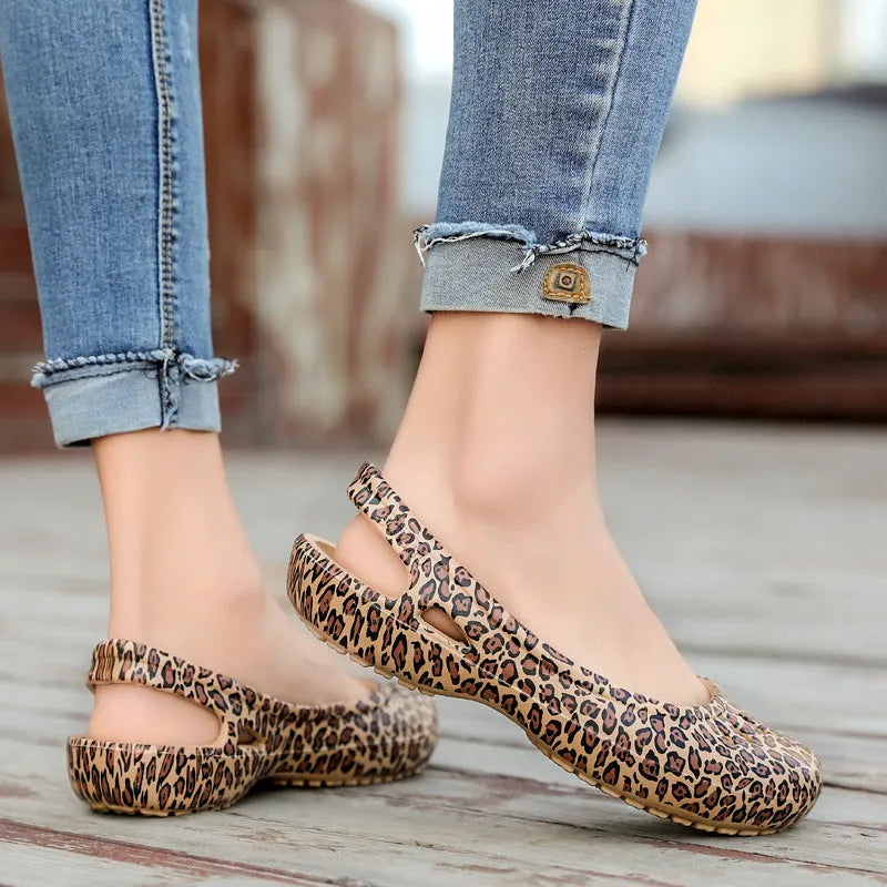 Ladies leopard pattern flat hole sandals with high elastic EVA rubber upper and sole in side view