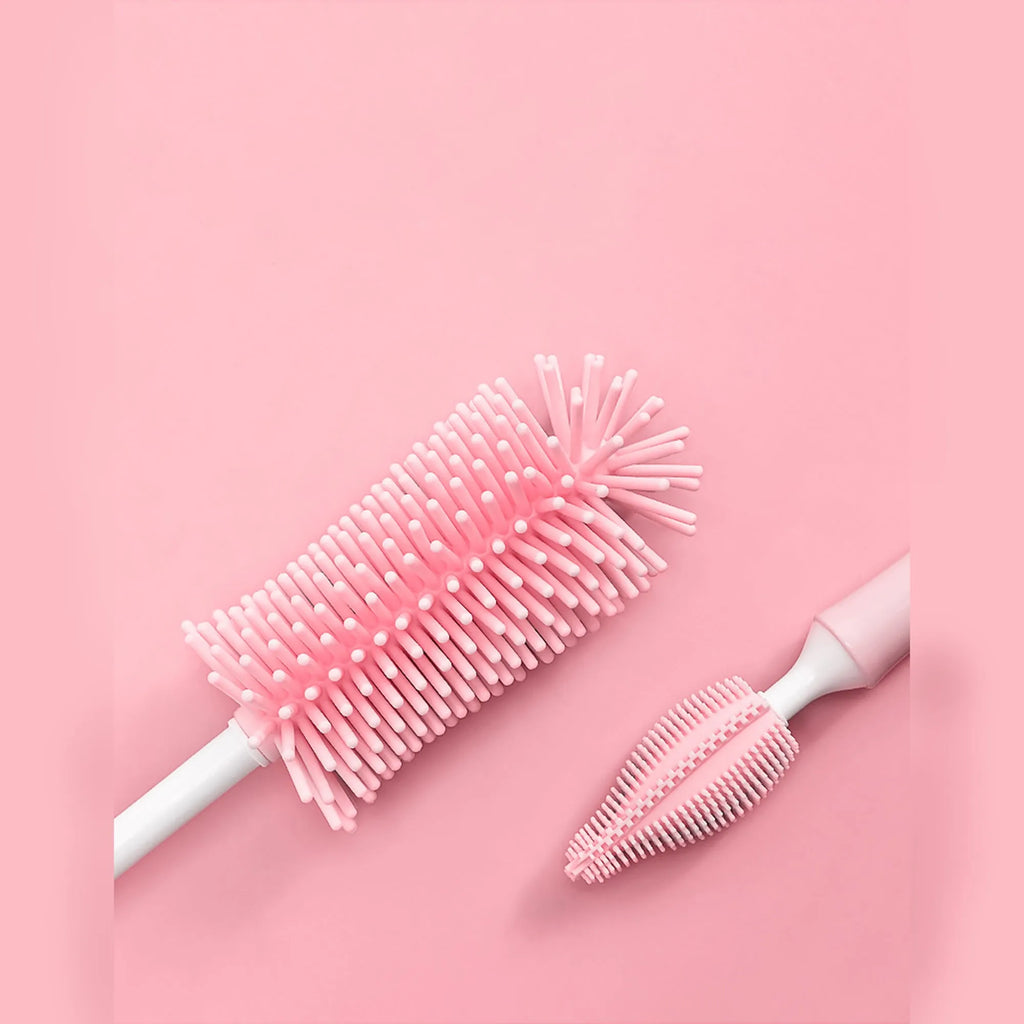 Silicone baby bottle brush cleaning set in blue, pink, and yellow colours