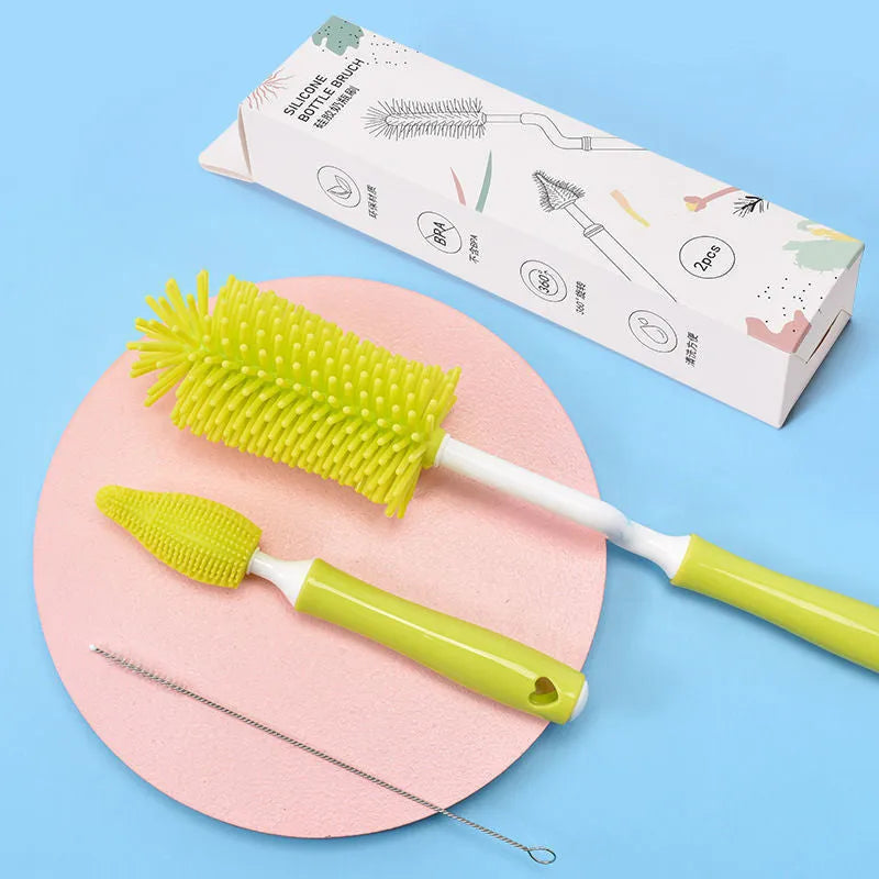 Silicone baby bottle brush cleaning set in blue, pink, and yellow colours