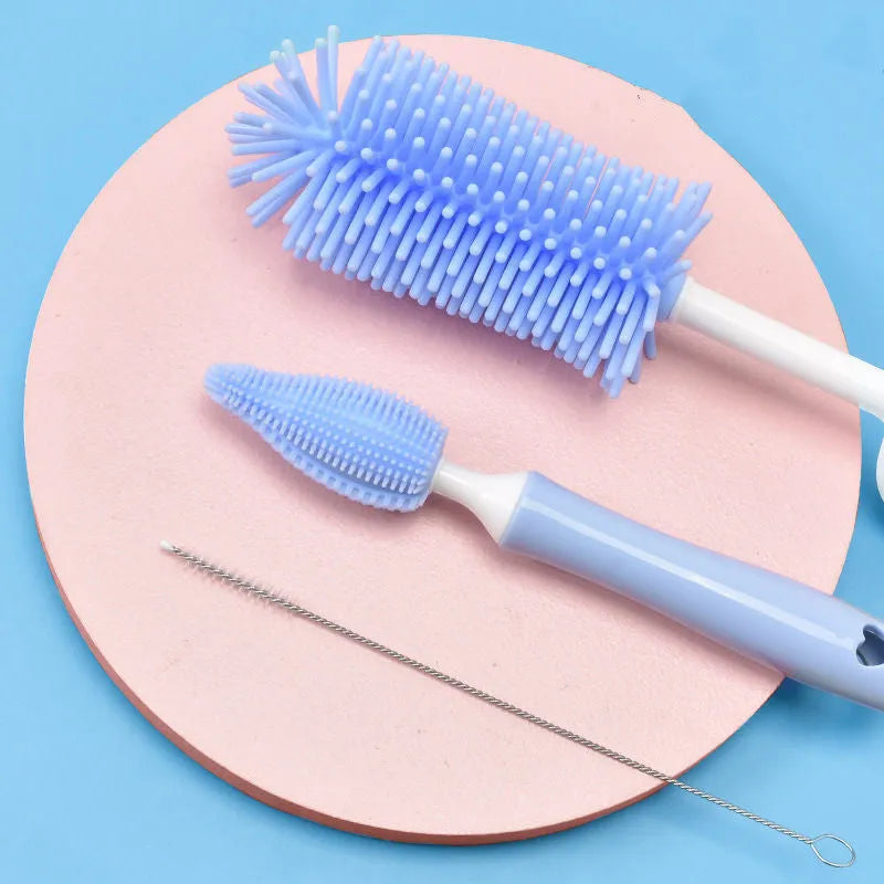 Silicone baby bottle brush cleaning set in blue, pink, and yellow colours