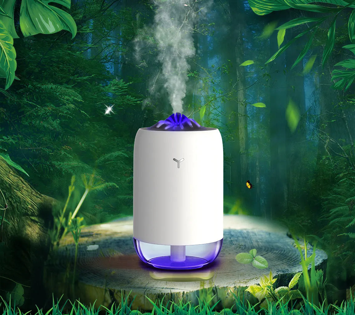 Magic Flame columnar ultrasonic humidifier in light blue colour on a desktop, showing mist output and USB cable.