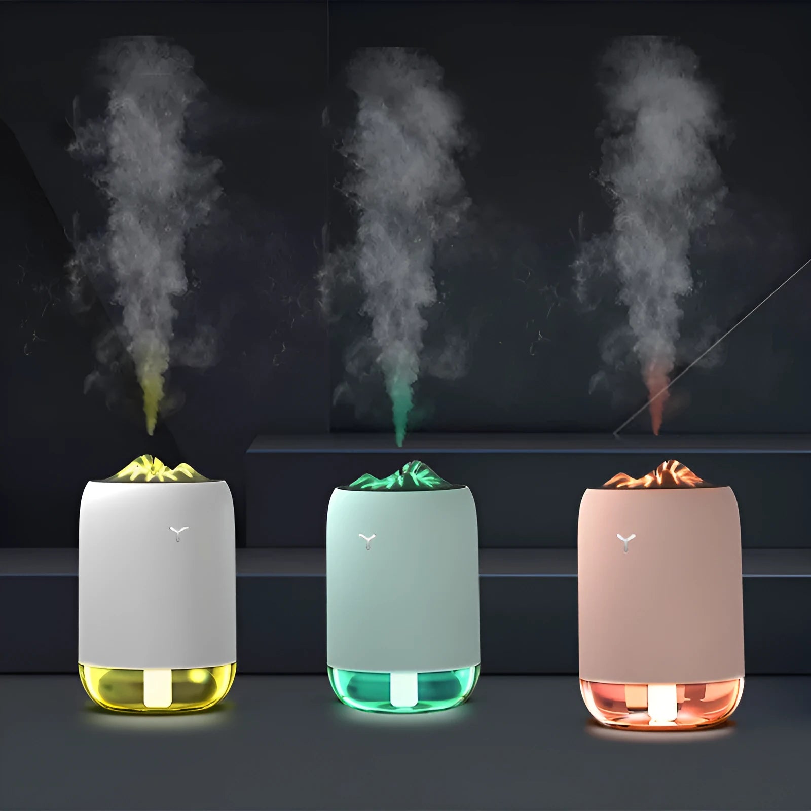 Magic Flame columnar ultrasonic humidifier in light blue colour on a desktop, showing mist output and USB cable.