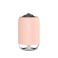 Magic Flame columnar ultrasonic humidifier in light blue colour on a desktop, showing mist output and USB cable.