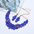 Women's alloy necklace earrings set with diamond finish, water wave chain, and flower pendant in artificial gems
