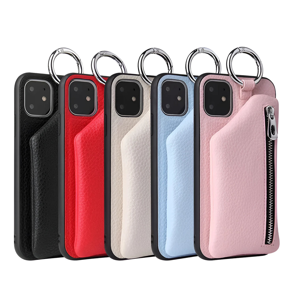 Pink imitation leather crossbody lanyard attached to a phone case on a table.