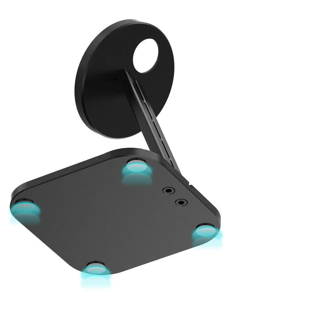 Black magnetic bracket wireless charger stand for iPhone 12 on a desktop
