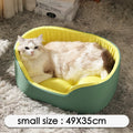A black cloth pet kennel for a medium-sized dog resting on a carpet.