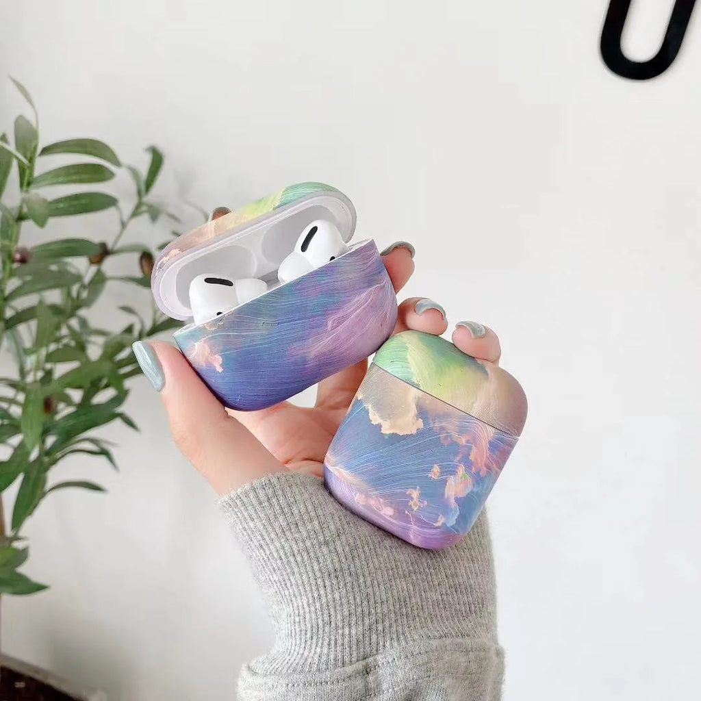 Hard shell protective sleeve for Apple AirPods with watercolour design in pink or blue colour options