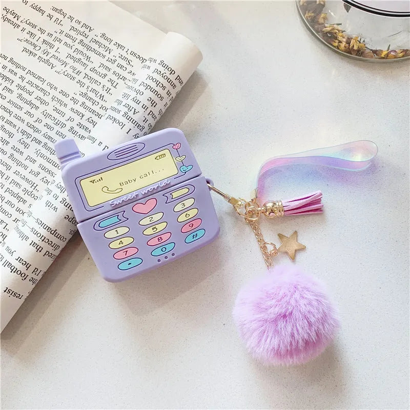 Purple silicone protective case for Apple AirPods with a white fur ball pendant attached.