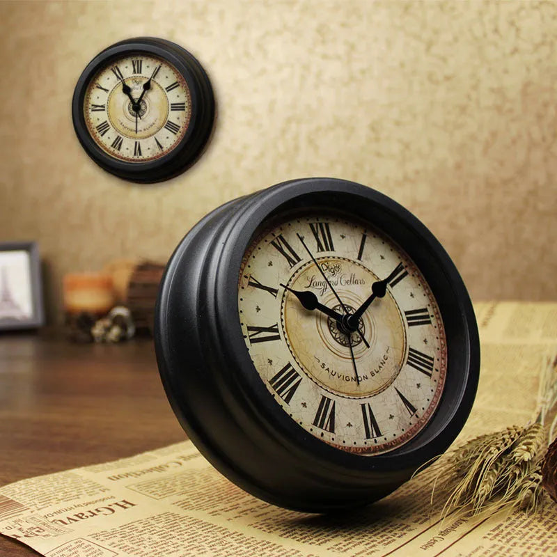 European retro style round desk alarm clock with silent sweep movement on a wooden surface.