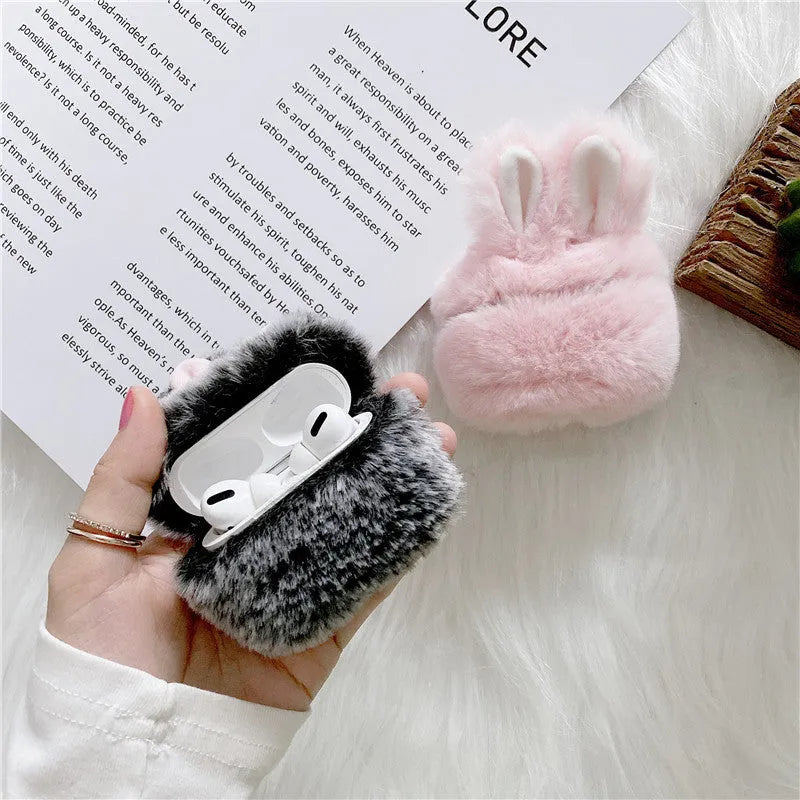 ISIDO brand pink silicone AirPods case cover with rabbit ears, shown next to a grey option.
