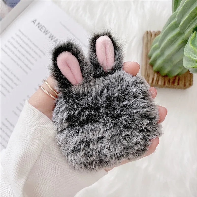 ISIDO brand pink silicone AirPods case cover with rabbit ears, shown next to a grey option.