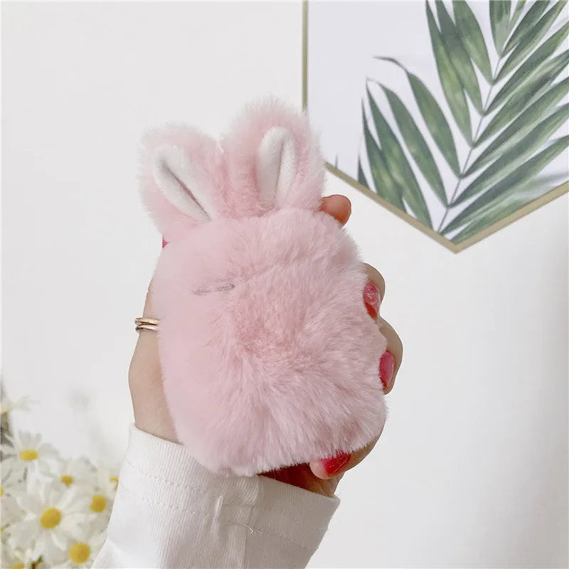 ISIDO brand pink silicone AirPods case cover with rabbit ears, shown next to a grey option.
