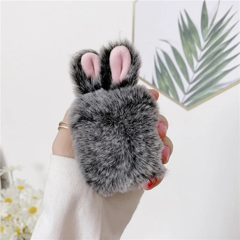 ISIDO brand pink silicone AirPods case cover with rabbit ears, shown next to a grey option.