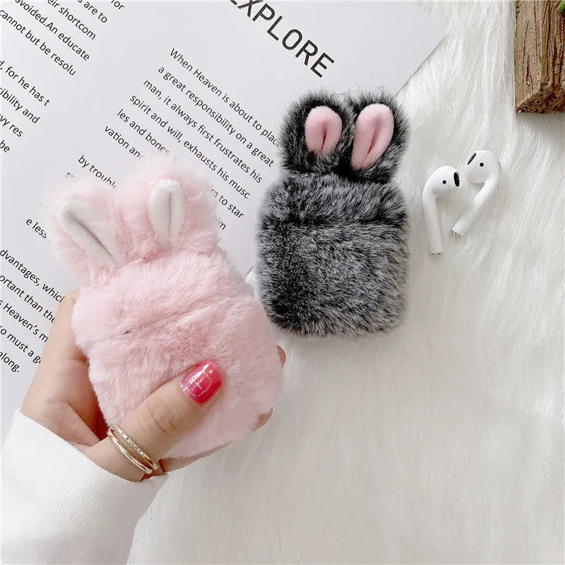 ISIDO brand pink silicone AirPods case cover with rabbit ears, shown next to a grey option.