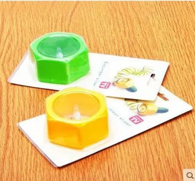 Yellow and green plastic spiral vegetable cutter showing 8cm diameter and spiral cutting mechanism