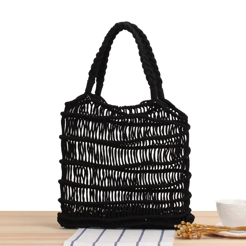A square medium woven straw shoulder bag in a national style, shown with double handles in a choice of colours.