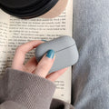 Plastic protective sleeve for AirPods case in solid colour, back-cover style with cutouts for port and lid