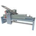 Aluminium alloy fixed angle sharpening tool for woodworking planers, chisels and carving knives on a workbench.