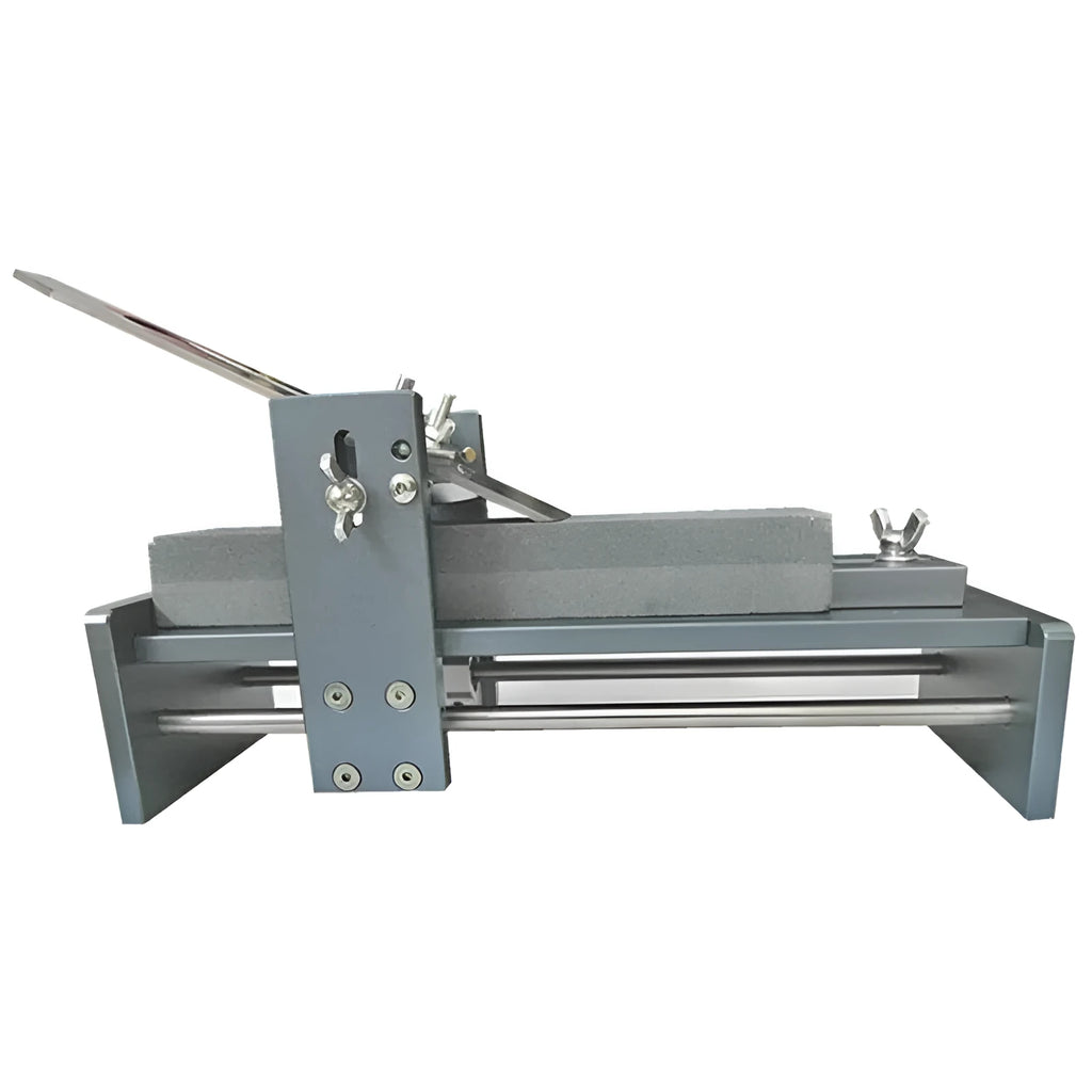 Aluminium alloy fixed angle sharpening tool for woodworking planers, chisels and carving knives on a workbench.