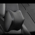 Car headrest neck pillow with perforated leather surface and memory cotton filling, in Beige, Black, Brown, or Red Wine