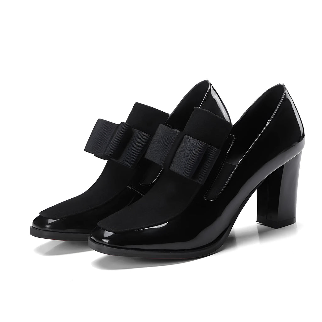 Women's patent leather high heel shoes with thick heels in black colour showing square toe design