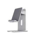 Alloy mobile phone and tablet holder in dark grey or silver on a desk