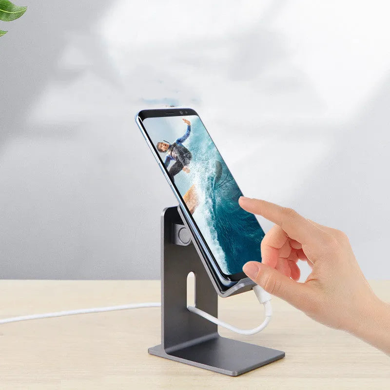 Alloy mobile phone and tablet holder in dark grey or silver on a desk