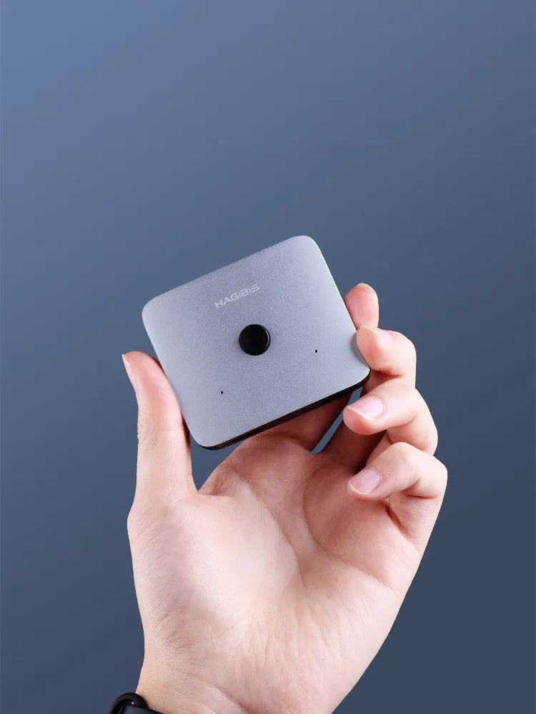 Grey Haibeisi HDMI switcher box with two input ports and one output port for 4K video sharing.