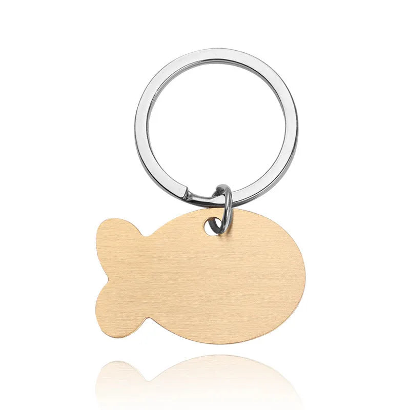 Personalised stainless steel bone-shaped pet ID tag keychain engraved with a name, available in gold, silver, or rose gold