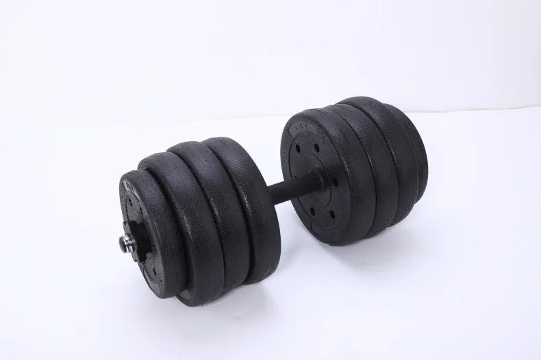 Black round head dumbbell pair 20 kg rubber coated on floor