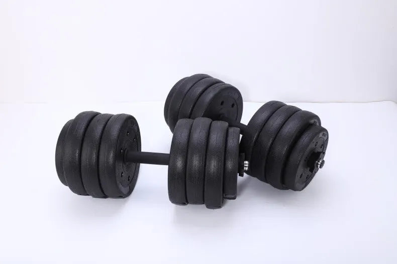 Black round head dumbbell pair 20 kg rubber coated on floor