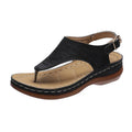 Women's wedge heel sandal in a solid colour with an adjustable back strap buckle.