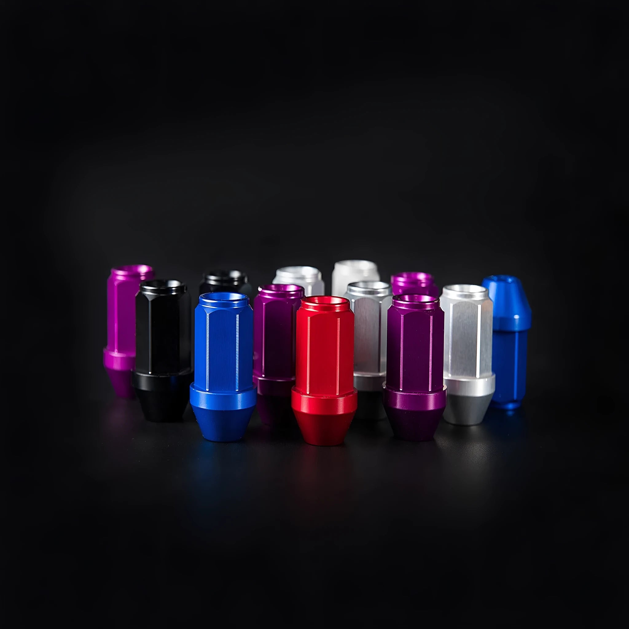 Set of 20 General Motors aluminium alloy wheel nuts in black, blue, grey, red, silver colours