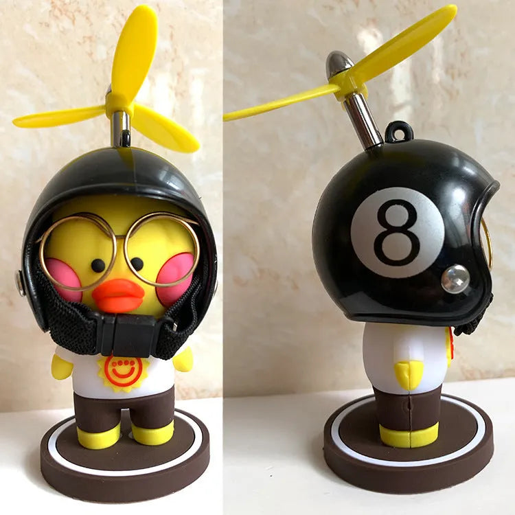 Cartoon duck car ornament in black and yellow, 7-9cm, with helmet and glasses details