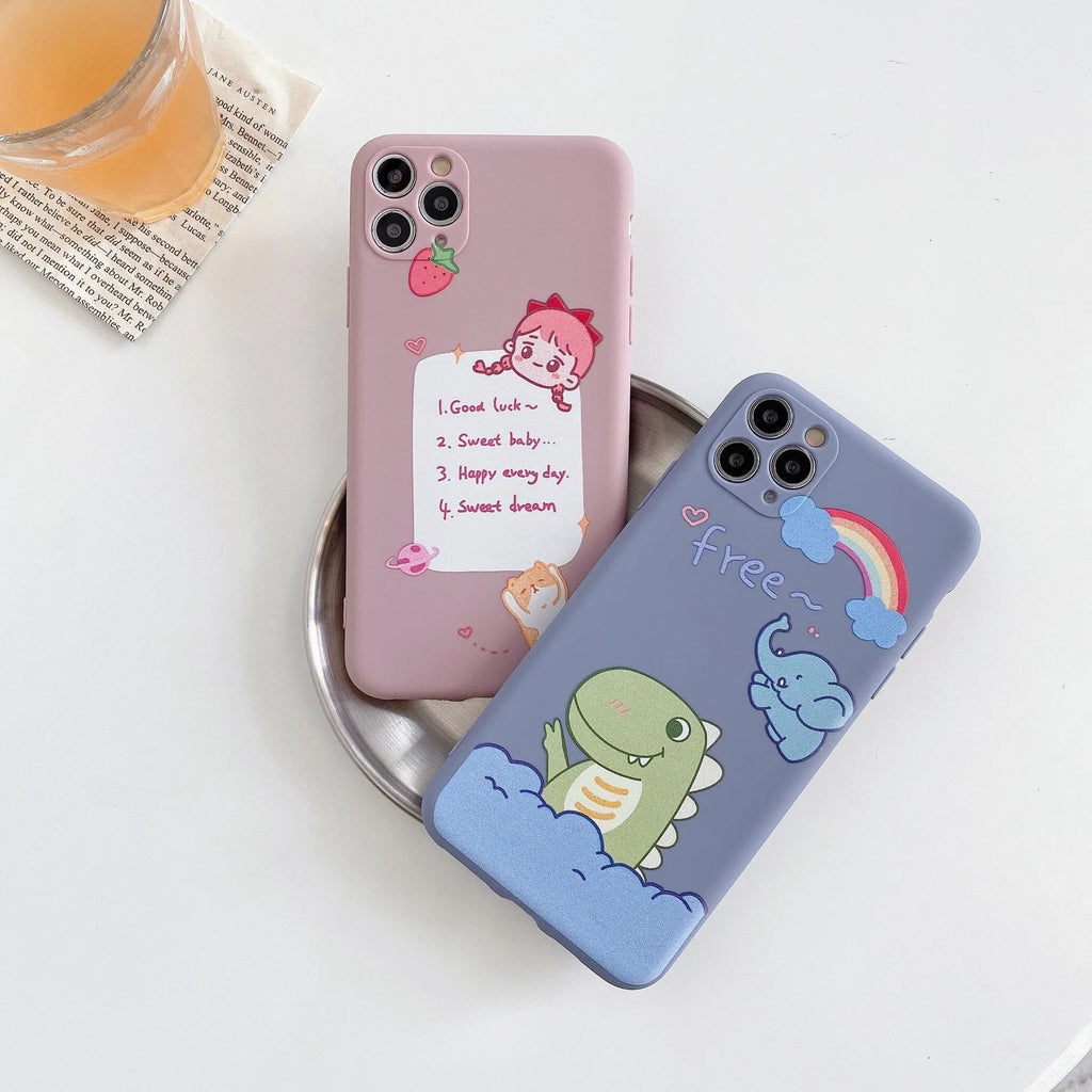 Blue soft shell iPhone case with printed cartoon dinosaur design, shown next to a pink version with a cat girl print.