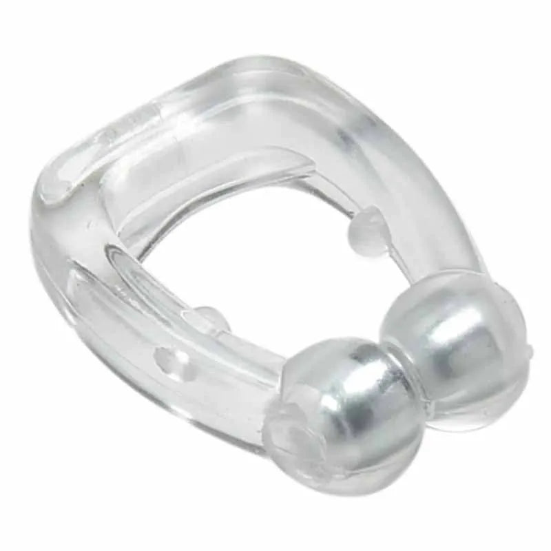Mini magnetic silicone anti-snoring nose clip in white on a transparent plastic box