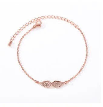 Gold angel wing charm bracelet for women copper electroplate Korean style on white background