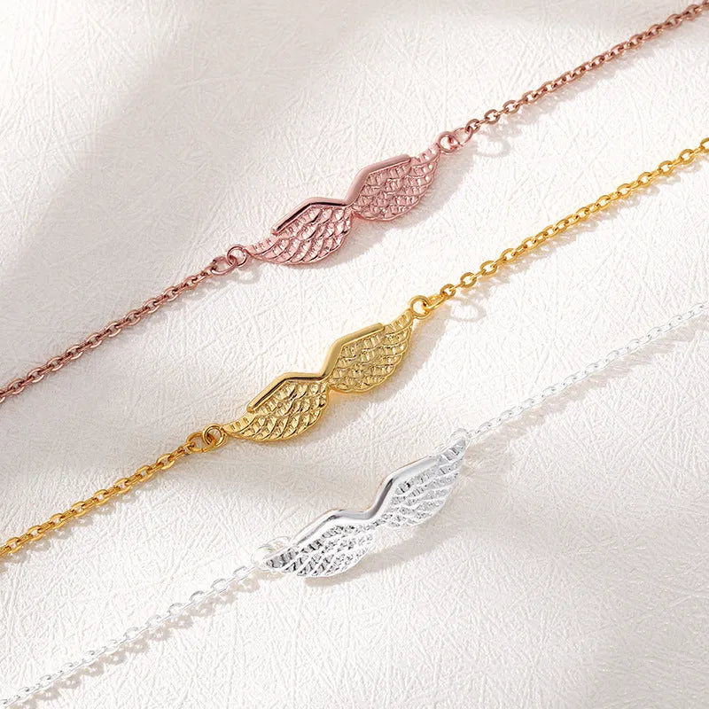 Gold angel wing charm bracelet for women copper electroplate Korean style on white background